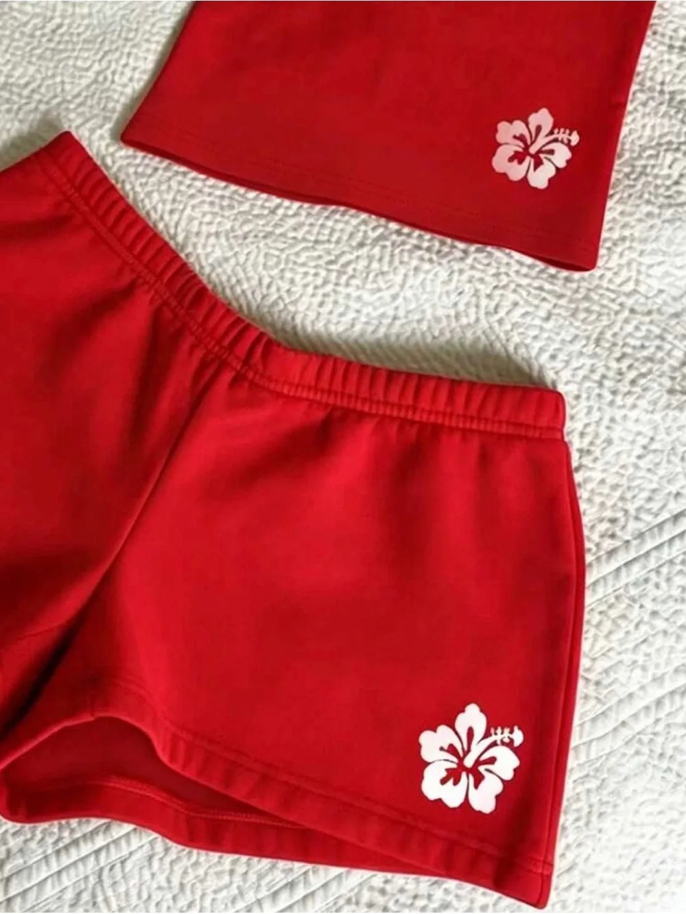SHEIN Red Athletic Shorts with White Hibiscus Accent